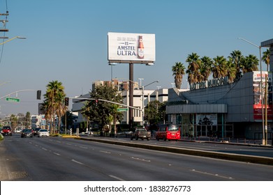 October 6, 2020: View of city street in Tijuana Mexico with billboards and buildings. 