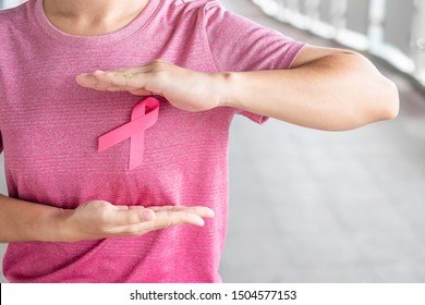 October Breast Cancer Awareness month, Woman in pink T- shirt with Pink Ribbon for supporting people living and illness. Healthcare, International women day and World cancer day concept - Shutterstock ID 1504577153