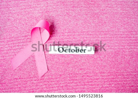 October Breast Cancer Awareness month,  Pink Ribbon on pink shirt for supporting people living and illness. Healthcare, International Women day and World cancer day concept