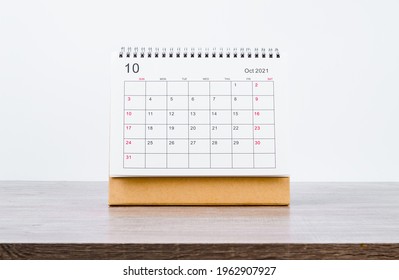 October Calendar 2021 on wooden table background. - Shutterstock ID 1962907927