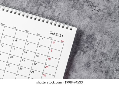 October Calendar 2021 on wooden table background.