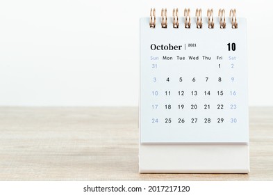 October Calendar 2021 on wooden table background. - Shutterstock ID 2017217120