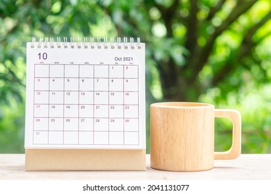 October month, Calendar desk 2021 for organizer to planning and reminder on wooden table with green nature background. - Shutterstock ID 2041131077
