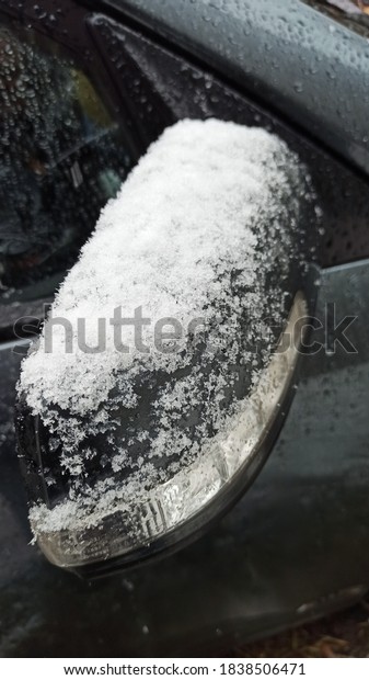 October in Russia. Snow covered the car. The\
first snow in Moscow.\

