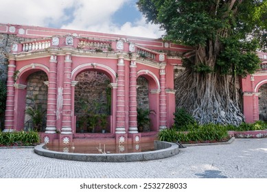 Od portuguese colonial architecture building - pink arcade - in a small city park in Macau City, China, Asia - Powered by Shutterstock