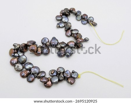 Odd baroque beads with yellow string 