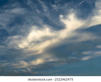 Odd evening cloud formation that by a stretch of imagination (pareidolia, a psychological phenomenon) might evoke a humanoid form reeling from a blow and falling backward across the sky