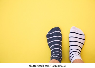 Odd Socks Day Concept. Mismatch Socks At Blue.