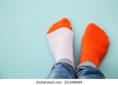 Odd Socks Day Concept. Mismatch Socks At Blue.