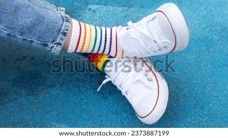 Odd Socks day. Down syndrome awareness concept.  a child in sneakers and mismatched socks 