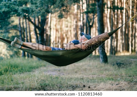 Similar – Foto Bild Young woman relaxing in a hammok