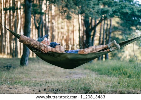 Similar – Foto Bild Young woman relaxing in a hammok