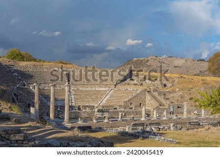Odeon, ancient theater ruins. Pergamum ruins at mountain as background. Asclepieion of Pergamon, ancient Greek and Roman sacred place and medical center. Bergama (Izmir region), Turkey (Turkiye)