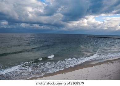 Odessa Bay of the Black Sea. 
On a cloudy day, the Black Sea rolls in small waves onto the sandy beaches of Odessa. - Powered by Shutterstock