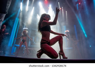Attractive babe with awesome body dancing on a cool concert