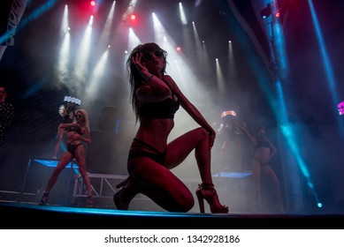 Attractive babe with awesome body dancing on a cool concert