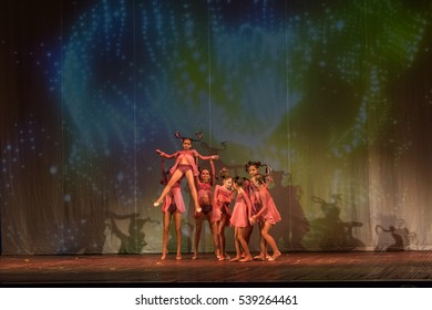 ODESSA, UKRAINE -17 December 2016: Children's musical performance cheerleaders on stage. Children's performance. Emotional children's stage show. Kids Cheerleading. Dancing on stage