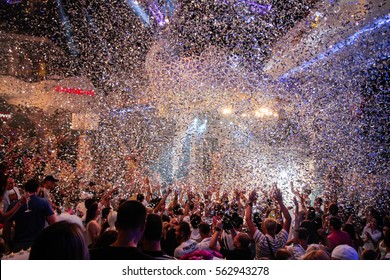 Odessa, Ukraine - 2013 August 17: Ibiza Club Night. Large Crowd Of People Having Fun In A Nightclub At A Concert, Light And Music Show. Cheerful Young People Showered Great Candy On Club Party.