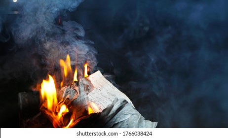 Odessa, Ukraine, 2020:notes burn in the fire                                    