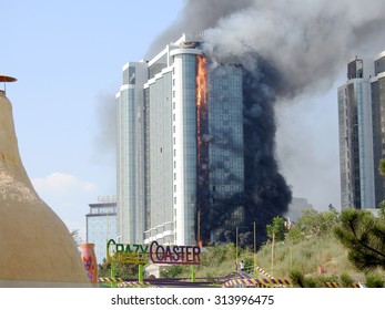           ODESSA, UKRAINE - 30 August 2015: The New Construction Skyscraper On Fire. Violation Of Safety When Building House. Extinguishing System Is Not Working. Large Losses Of Construction Company.