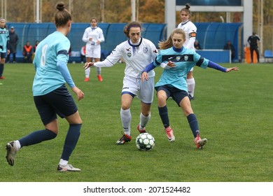ODESSA, UKRAINE -31 DECEMBER 2021: Women's football on grass field of stadium. Football Championship among women White - FC Chernomorets Odessa - Yunost Chernigov. Game moment of girls football