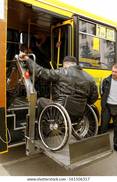 ODESSA,\
UKRAINE - April 6, 2012: Presentation of issue of new buses for \
disabled with an improved system of ramps and lift for mechanized\
of rise automatically disabled in\
wheelchairs