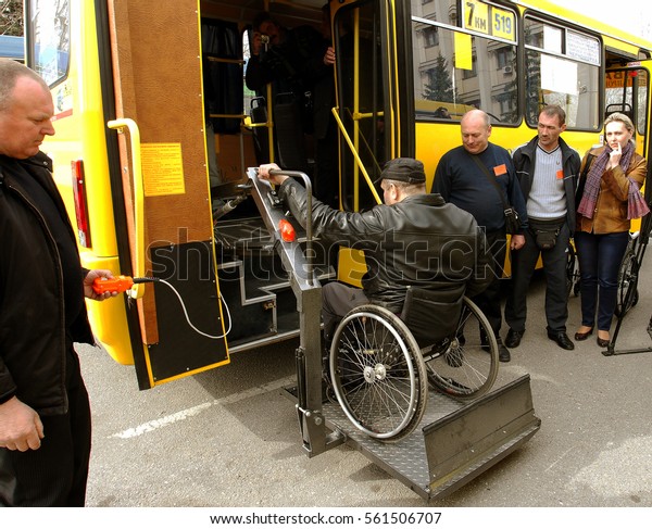 ODESSA,\
UKRAINE - April 6, 2012: Presentation of issue of new buses for \
disabled with an improved system of ramps and lift for mechanized\
of rise automatically disabled in\
wheelchairs