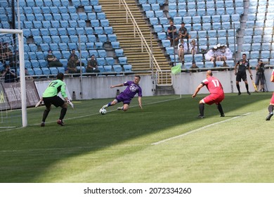 ODESSA, UKRAINE - Aug 24, 2021: Football. Traditional Cup Of Ukraine Among ATO Veterans. Veterans Play Football On Green Lawn Of  Stadium. Game Moment Of Football Fight For Cup. Vivid Emotions Of Game