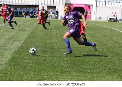 ODESSA, UKRAINE - Aug 24, 2021: Football. Traditional Cup Of Ukraine Among ATO Veterans. Veterans Play Football On Green Lawn Of  Stadium. Game Moment Of Football Fight For Cup. Vivid Emotions Of Game