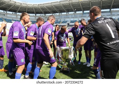 ODESSA, UKRAINE - Aug 24, 2021: Football. Traditional Cup Of Ukraine Among ATO Veterans. Veterans Play Football On Green Lawn Of  Stadium. Game Moment Of Football Fight For Cup. Vivid Emotions Of Game