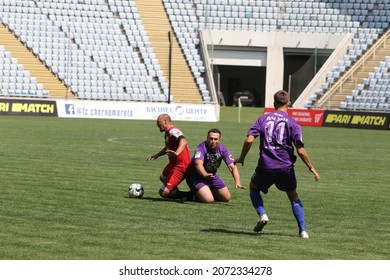 ODESSA, UKRAINE - Aug 24, 2021: Football. Traditional Cup Of Ukraine Among ATO Veterans. Veterans Play Football On Green Lawn Of  Stadium. Game Moment Of Football Fight For Cup. Vivid Emotions Of Game