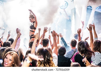 Odessa, Ukraine August 21, 2015: Ibiza Night Club Dj Party People Enjoy Of Music Dancing Sound With Colorful Light, Smoke Machine, Lights Show And Dance Show. Hands Up In The Earth.