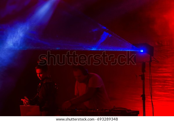 ODESSA, UKRAINE - August 5, 2017: lights show.\
Laser show. Nightclub dj parties use music, dancing sound with\
bright light. Club night light dj party club. With car for smoke\
and lights
