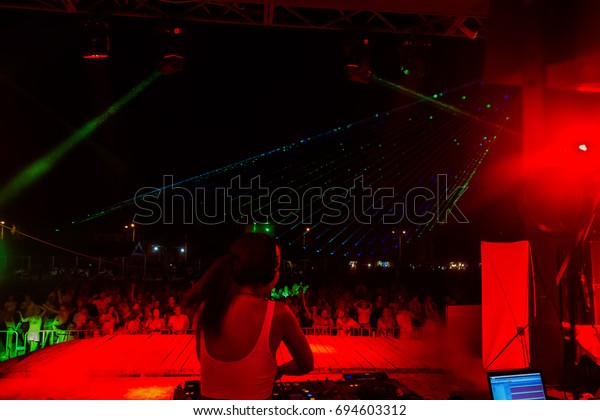 ODESSA, UKRAINE - August 5, 2017: lights show.\
Laser show. Nightclub dj parties use music, dancing sound with\
bright light. Club night light dj party club. With car for smoke\
and lights