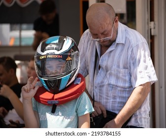 ODESSA, UKRAINE - August 7, 2022: Healthy Lifestyle. Sport Family. Family Vacation At Karting Track. Children With Parents Go In For Motorsports. Karting. Hobbies, Sports Education, Leisure And Lifestyle