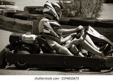 ODESSA, UKRAINE - August 7, 2022: Healthy Lifestyle. Sport Family. Family Vacation At Karting Track. Children With Parents Go In For Motorsports. Karting. Hobbies, Sports Education, Leisure, Lifestyle