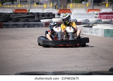 ODESSA, UKRAINE - August 7, 2022: Healthy Lifestyle. Sport Family. Family Vacation At Karting Track. Children With Parents Go In For Motorsports. Karting. Hobbies, Sports Education, Leisure, Lifestyle