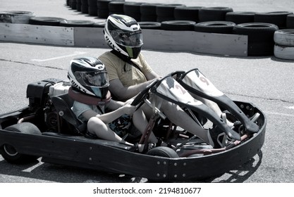 ODESSA, UKRAINE - August 7, 2022: Healthy Lifestyle. Sport Family. Family Vacation At Karting Track. Children With Parents Go In For Motorsports. Karting. Hobbies, Sports Education, Leisure, Lifestyle