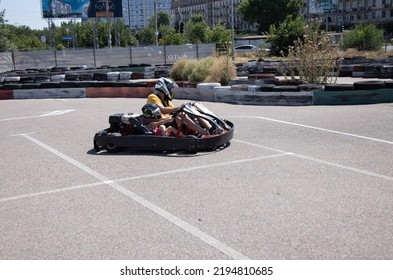 ODESSA, UKRAINE - August 7, 2022: Healthy Lifestyle. Sport Family. Family Vacation At Karting Track. Children With Parents Go In For Motorsports. Karting. Hobbies, Sports Education, Leisure, Lifestyle