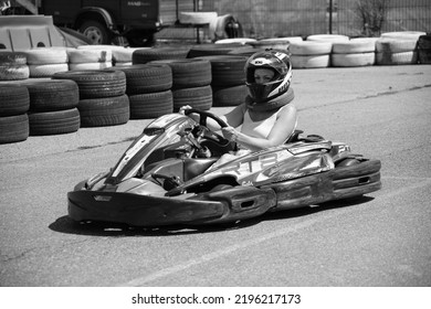 ODESSA, UKRAINE - August 7, 2022: Healthy Lifestyle. Sport Family. Family Vacation At Karting Track. Children With Parents Go In For Motorsports. Karting. Hobbies, Sports Education, Leisure, Lifestyle