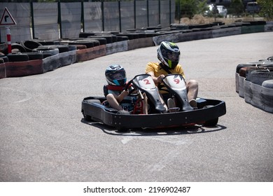 ODESSA, UKRAINE - August 7, 2022: Healthy Lifestyle. Sport Family. Family Vacation At Karting Track. Children With Parents Go In For Motorsports. Karting. Hobbies, Sports Education, Leisure, Lifestyle