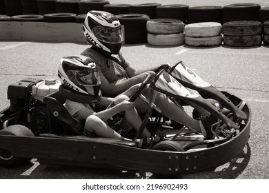 ODESSA, UKRAINE - August 7, 2022: Healthy Lifestyle. Sport Family. Family Vacation At Karting Track. Children With Parents Go In For Motorsports. Karting. Hobbies, Sports Education, Leisure, Lifestyle