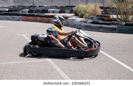 ODESSA, UKRAINE - August 7, 2022: Healthy Lifestyle. Sport Family. Family Vacation At Karting Track. Children With Parents Go In For Motorsports. Karting. Hobbies, Sports Education, Leisure, Lifestyle