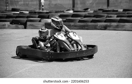 ODESSA, UKRAINE - August 7, 2022: Healthy Lifestyle. Sport Family. Family Vacation At Karting Track. Children With Parents Go In For Motorsports. Karting. Hobbies, Sports Education, Leisure, Lifestyle