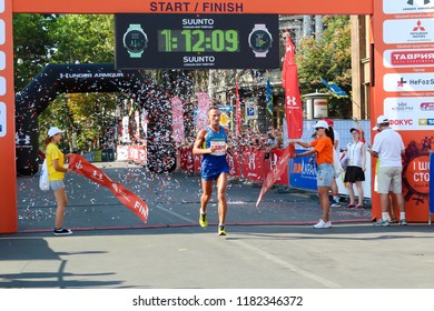 ODESSA, UKRAINE - CIRCA AUG 2018: Excited Man Crossing The Finshline Of Half Marathon. Winner Of Marathon.