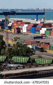 ODESSA, UKRAINE - July 14, 2017: Marine Industrial Commercial Port. Container terminal. Cargo container terminal of sea freight industrial port. Sea freight, container cranes. Industrial goods in port