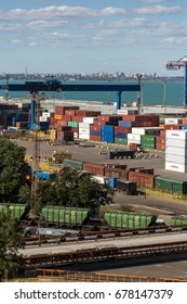 ODESSA, UKRAINE - July 14, 2017: Marine Industrial Commercial Port. Container terminal. Cargo container terminal of sea freight industrial port. Sea freight, container cranes. Industrial goods in port