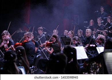ODESSA, UKRAINE - July 16, 2019: A Concert By The Symphony Orchestra Of Andrey Cherny On The Theater Stage Of The Odeskogot Opera Theater. Symphony Orchestra Musicians Perform OSCAR Cinematic Hits