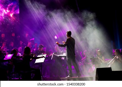 ODESSA, UKRAINE - July 16, 2019: Concert Of The Andrei Cherny Symphony Orchestra On The Theatrical Stage Of The Odessa Opera House. Musicians Of The Symphony Orchestra Perform OSCAR Cinematic Hits