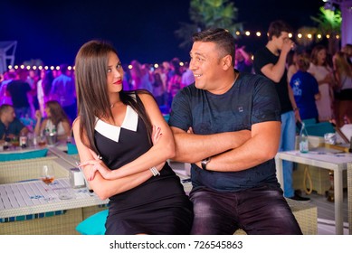 Odessa, Ukraine June 20, 2015: Ibiza night club. People smiling and looks happy during concert in night club party. Man and woman have fun at club. Boy and girl at night club party - Shutterstock ID 726545863